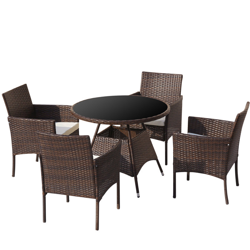 Kruger 4 - Person Patio Dining Set Round Table with Cushions Included