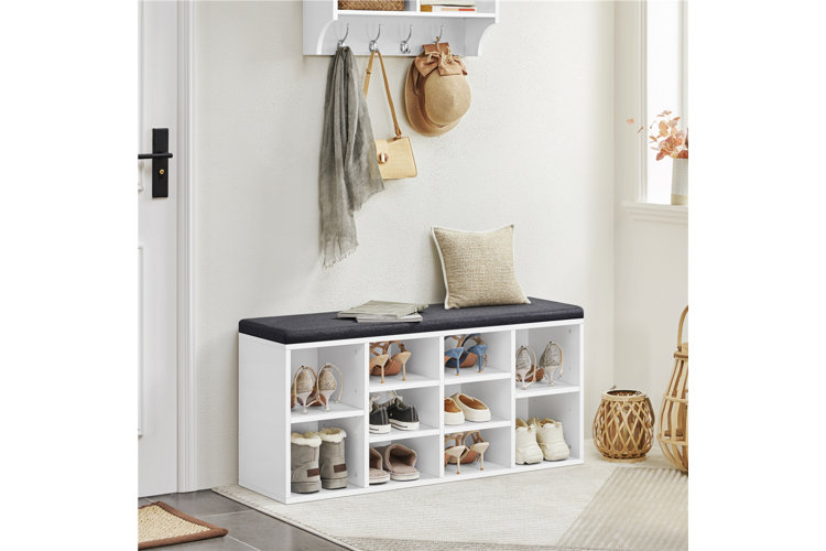 white cubby bench with storage with black foam top