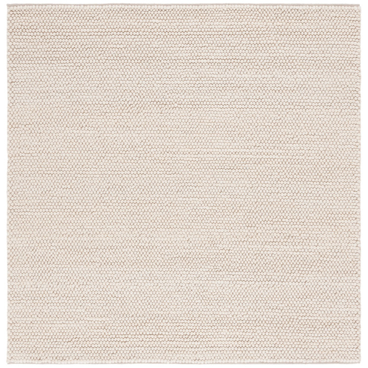 Tapis ivoire fait à la main de couleur unie Sitte