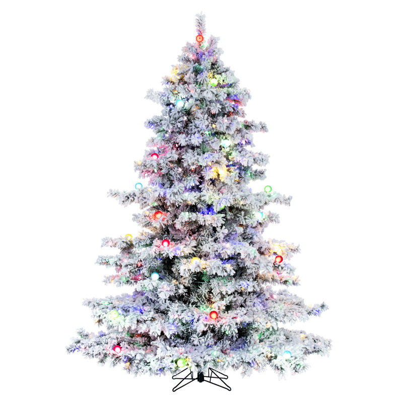 Vickerman 10' x 82" Flocked Alaskan Artificial Pre-Lit Christmas Tree with 91 Warm White G50 and 1200 Warm White LED Mini Lights, 2911 Flocked Realistic PVC Tips, 6' Step On/Off Power Cord and Folding Metal Tree Stand. Assembly is required.