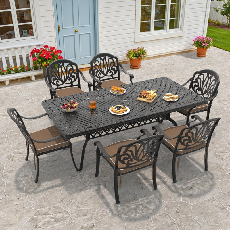 Ensemble repas de patio Asraf avec coussins bruns inclus