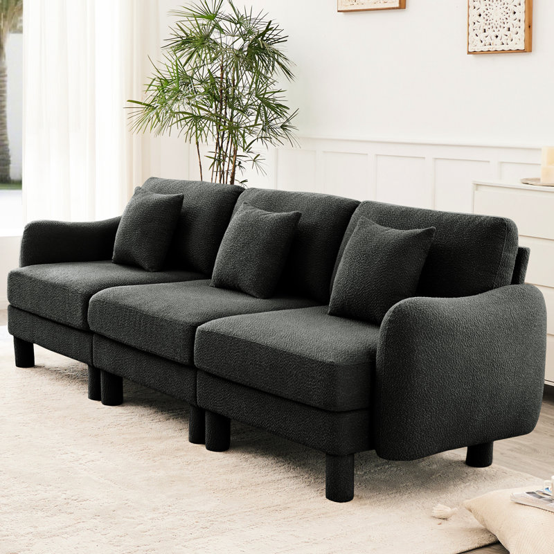 Canapé rose à 3 boucles avec pieds uniques et cylindriques, assise moelleuse pour les soirées de détente, Rose