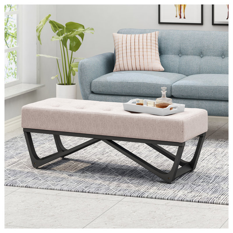 Repose-pieds rembourré en tissu beige avec profil moderne