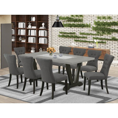 9-piece set with a wonderful cement kitchen table top and 8 dark Gotham grey dining chairs with nail heads and high stylish button tufted chair back, wire brushed black finish