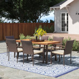 Anivea 6 - Person Acacia Wicker Patio Dining Set with Rectangular Table , Cushions Included