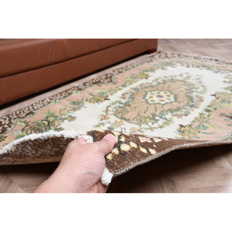 Tapis turc authentique tissé à motif floral traditionnel dans des tons de terre pour une décoration intérieure élégante