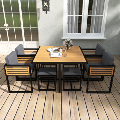 Ensemble de salle à manger 9 pièces en bois d'acacia, mobilier de jardin d'extérieur peu encombrant, 4 chaises coussinées grises et 4 repose-pieds et table carrée pour la cour, le jardin, la terrasse et la piscine