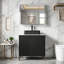 Meuble-lavabo simple moderne de 30 po de largeur avec lavabo en céramique noire, comptoir en pierre frittée et portes à fermeture douce.