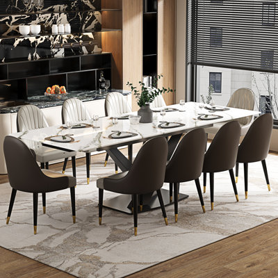 Ensemble de table de salle à manger avec plateau en pierre frittée extensible de 94,5 po et 8 chaises en similicuir