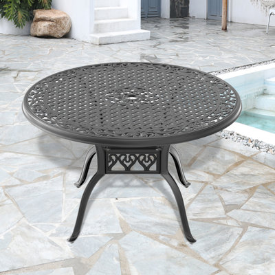 Table de salle à manger en fonte d'aluminium avec cadre noir et trou pour parasol
