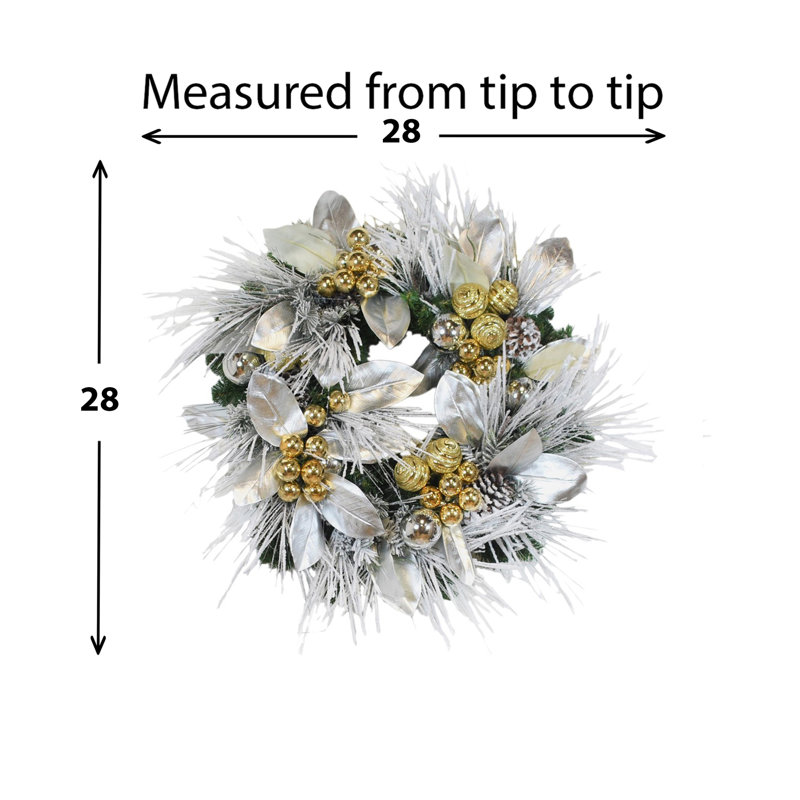 Couronne de Noël 28 po Jimenna décorée de branches de neige, de feuilles de magnolia et d'ornements
