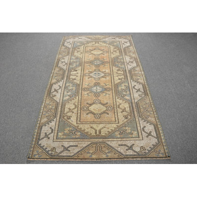 Vintage Turkish Rug Featuring Soft Pastel Tones and Complex Geometric Patterns