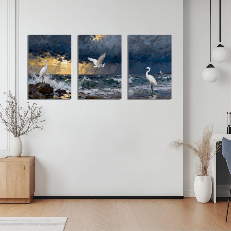Ensemble de 3 tableaux sur toile tendue représentant un héron blanc au coucher du soleil sur l'océan, H 24 po x l 48 po