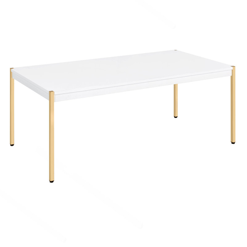 Table basse rectangulaire blanche et dorée.