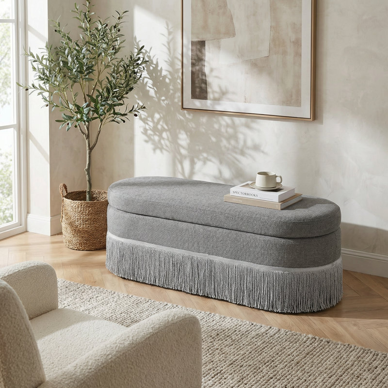 Oval Upholstered Storage Ottoman with Fringe Trim and Lift-Top Lid for Multi-Functional Use in Living Room or Bedroom, Gray