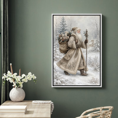 «Père Noël marchant dans un village enneigé», impression encadrée