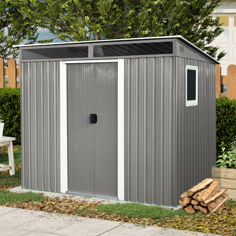 Abri de jardin en métal de 2,4 m x 1,8 m avec structure à ossature apparente - Structure stable et résistante, de couleur grise, reposant sur des fondations solides.