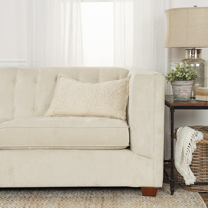 Coussin lombaire beige à motif botanique brodé