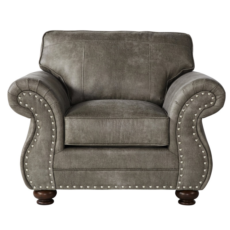 Chaise grise en similicuir gris avec magnifique coussin de dossier dans des matériaux de qualité