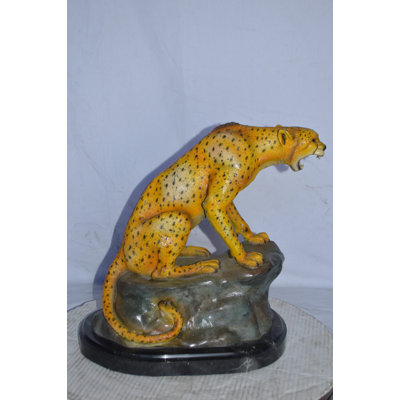 Cheetah Sitting On A Rock Growling Bronze Statue - Size: 18"L X 12"W X 18"H.
