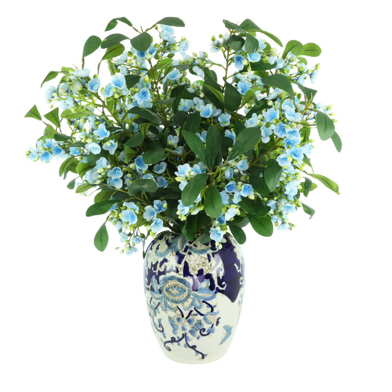 Tiges en herbe dans un vase décoratif, Bleu