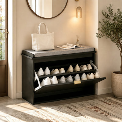 This entryway shoe bench features a black and gray color scheme and comes with two adjustable shelves, accommodating up to eight pairs of shoes (maximum size: 11).