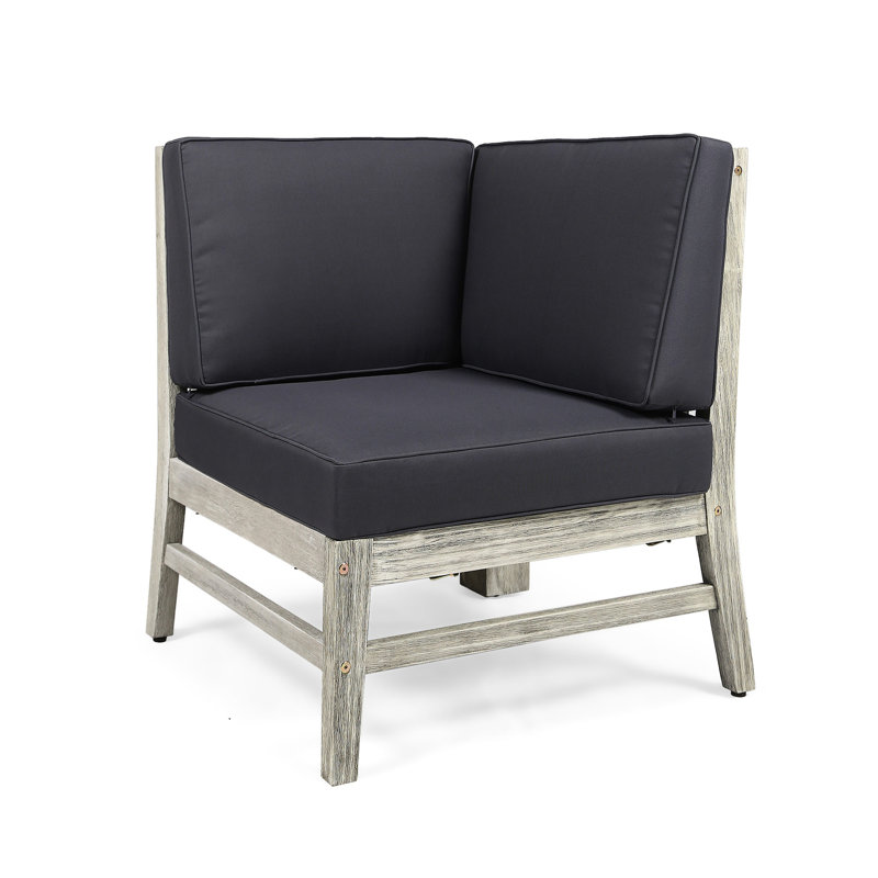 Fauteuil d'angle gris foncé en bois avec coussins et siège de piscine