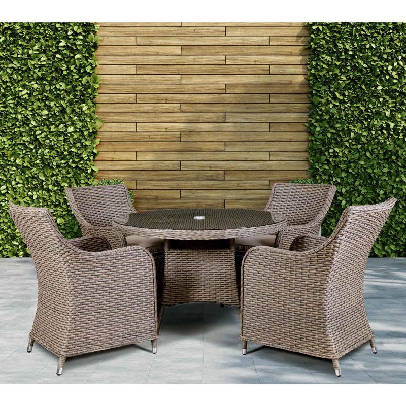 Cynthis 4 - Person Wicker Patio Dining Set with Round Table , Cushions Included