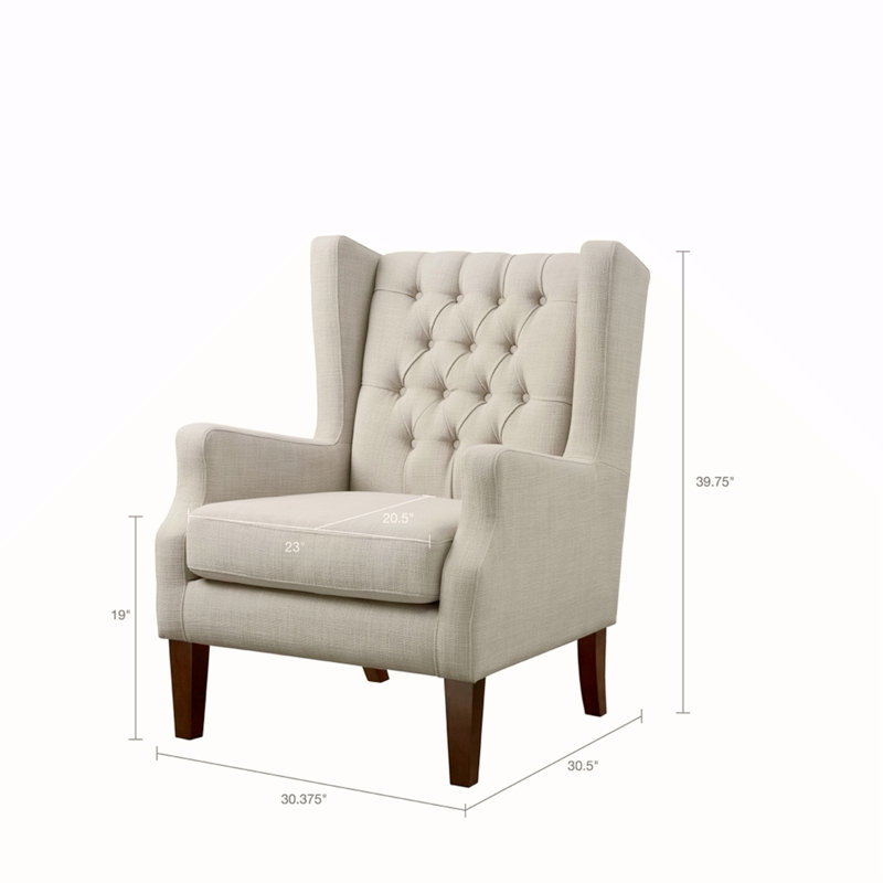 Fauteuil à oreilles capitonné