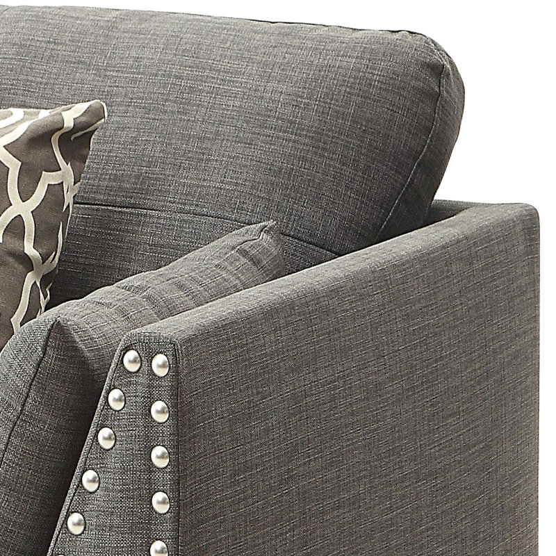 Fauteuil d'appoint gris anthracite avec accoudoirs évasés et coussins confortables assortis