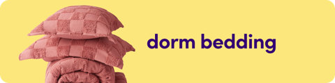 Category banner for dorm bedding featuring a stack of pink textured pillows and a matching comforter.