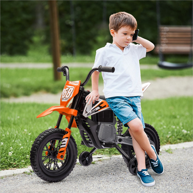 Moto électrique pour enfants avec roues d'entraînement et suspension arrière en orange riche