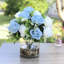 Arrangement floral rose dans un vase en verre
