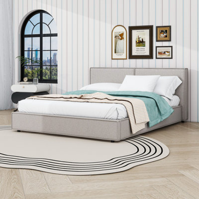 Grand lit plateforme tapissier avec tête de lit, pieds centraux et lattes de bois