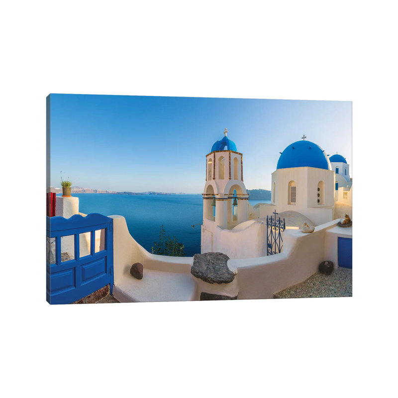 Greece, Oia. Sunrise On Greek Orthodox Church And Village. by Jaynes Gallery - Wrapped Canvas Print, 66.04 cm H x 45.72 cm W
