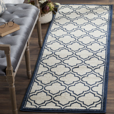 Ammundsen Geometric Area Rug in Ivory/Navy