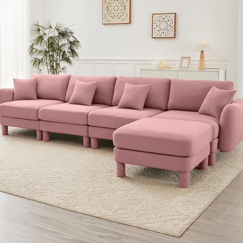 Canapé modulaire en L convertible en forme de L à 4 places avec pieds en forme de coquillage, amovibles et cylindriques. Confort et style pour votre espace de bureau