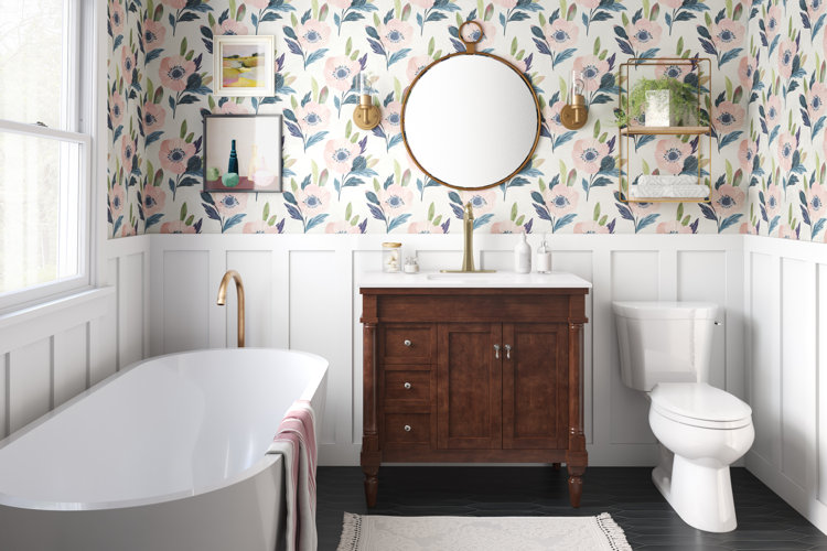 3/4 bath with a bathtub, single vanity, toilet, and floral wallpaper