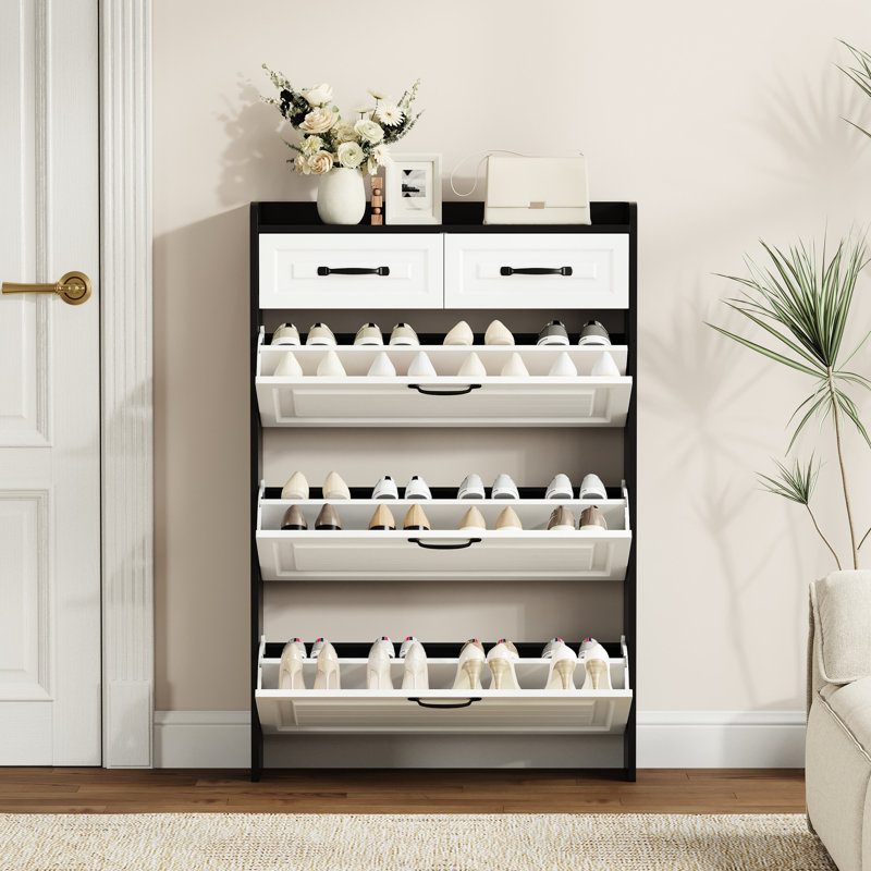 Armoire à chaussures noire avec 3 portes rabattables et 2 tiroirs, élégante et fonctionnelle pour les petits espaces de vie. Tiroirs faciles à utiliser dans les espaces