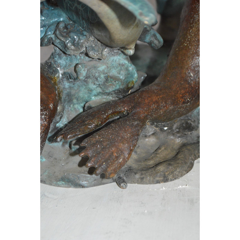 Brass Girl feeding a dolphin and seals bronze fountain -  Size: 28"L x 17"W x 37"H.
