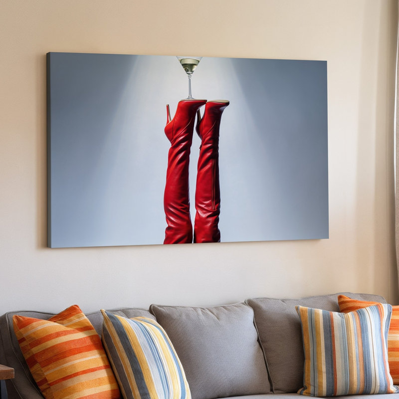 Toile d'une composition saisissante avec une paire de cuissardes rouges lustrées, des bottes à talon aiguille élégamment positionnées vers le haut contre une toile murale