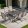 Patio 7-piece Textilene Dining Set With Umbrella Hole And C-spring Motion