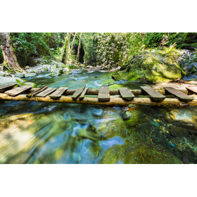 Bridge Over A Crystal River by Dopeyden - Wrapped Canvas Print