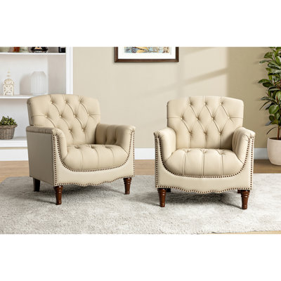 Fauteuil en cuir véritable capitonné Annja