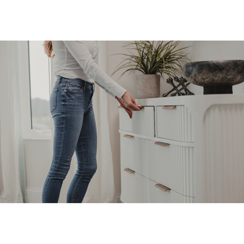 Timeless Elegant White Mahogany Wood Dresser with Intricate Reeded Design, Laser-Cut Flawless Finish, Seven Spacious Drawers, and Convenient Built-In Charging for Modern Bedroom Sophistication