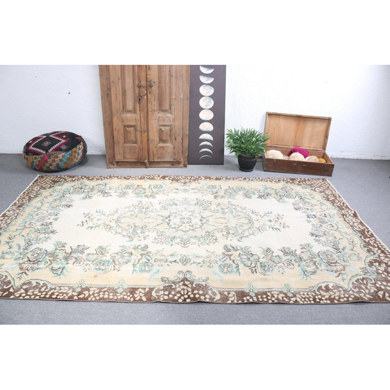Vintage Turkish-inspired large beige floral rug designed for enhancing living room aesthetics
