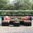 Ayomikun 7 Piece Rattan Sectional Seating Group with Cushions