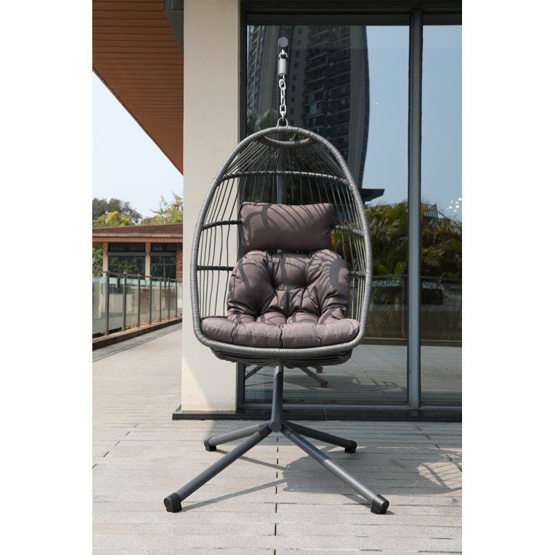 Fauteuil à œufs avec coussin gris foncé et support