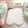 Tapis blanc moelleux en fausse peau de mouton