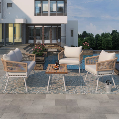 Ensemble de 4 pièces de mobilier de patio en corde Boho, mobilier d'extérieur avec table en bois d'acacia, ensemble de conversation de patio avec assise profonde et coussin épais pour le balcon de la cour arrière